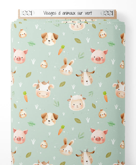 Tissu - Visages d'animaux sur vert