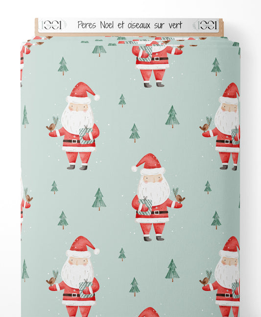 Tissu - Pères Noël et oiseaux sur vert