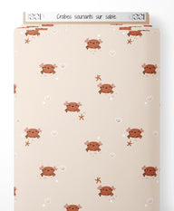 Tissu - Crabes souriants sur sable