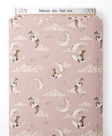 Tissu - Animaux ailés sur fond rose