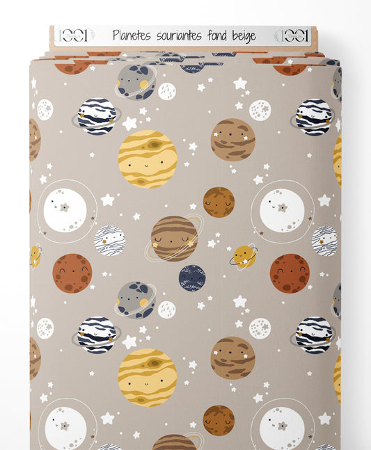 Tissu - Planètes souriantes sur fond beige