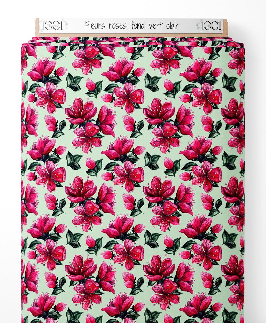Tissu - Fleurs roses sur fond vert clair