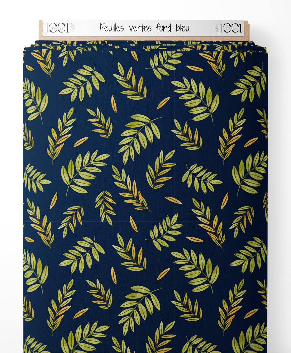 Tissu - Feuilles vertes sur fond bleu