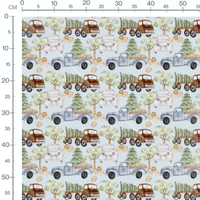 Tissu - Camions sur fond bleu clair