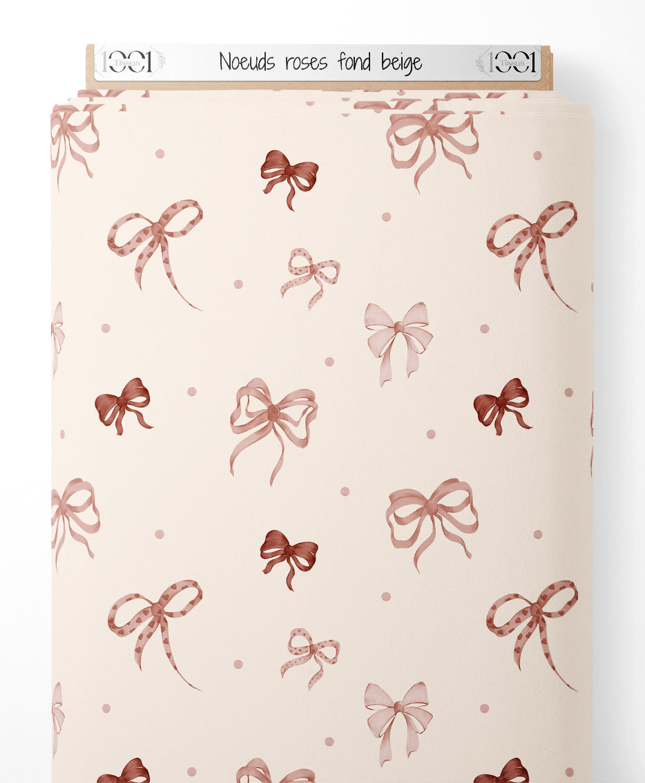 Tissu - Nœuds roses sur fond beige