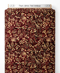 Tissu - Fleurs dorées sur fond bordeaux