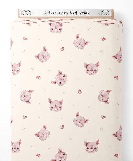Tissu - Cochons roses sur fond crème