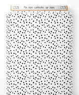 Tissu - Pois noirs contrastés sur blanc