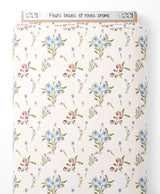 Tissu - Fleurs bleues et roses crème