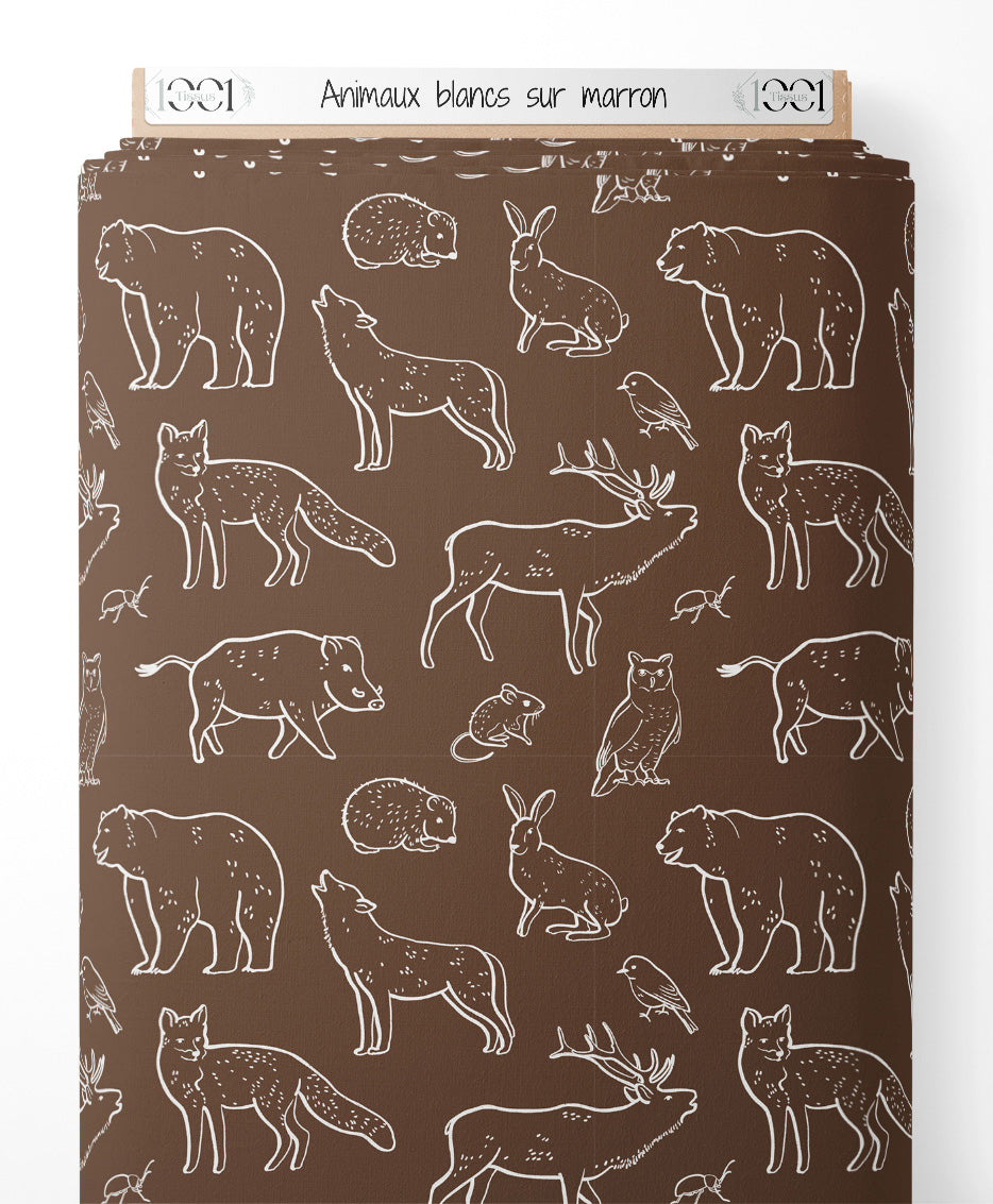 Tissu - Animaux blancs sur marron