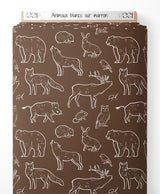 Tissu - Animaux blancs sur marron