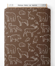 Tissu - Animaux blancs sur marron
