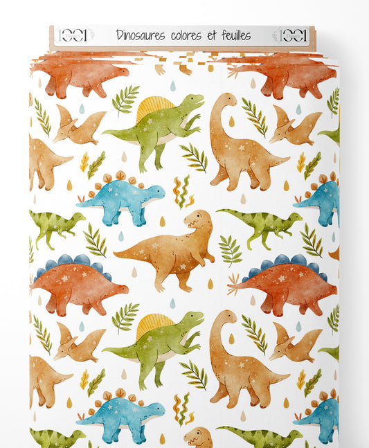 Tissu - Dinosaures colorés et feuilles