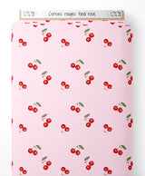 Tissu - Cerises rouges sur fond rose