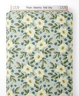 Tissu - Fleurs blanches sur fond bleu