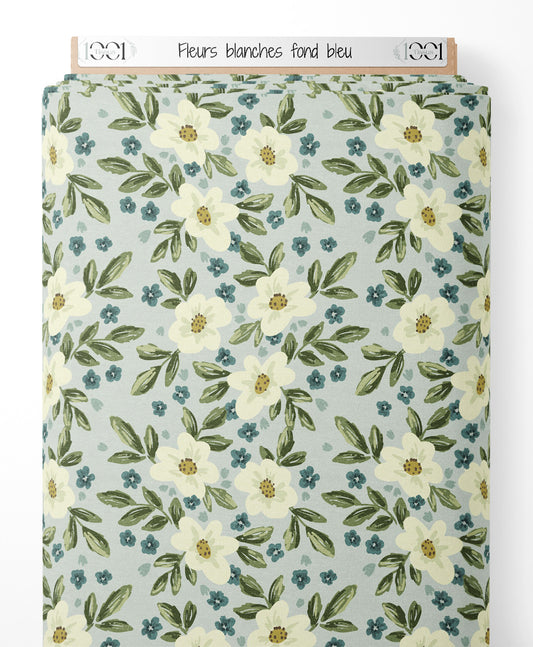 Tissu - Fleurs blanches sur fond bleu