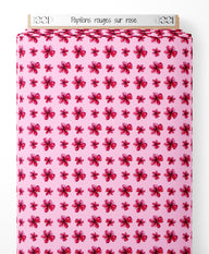 Tissu - Papillons rouges sur rose