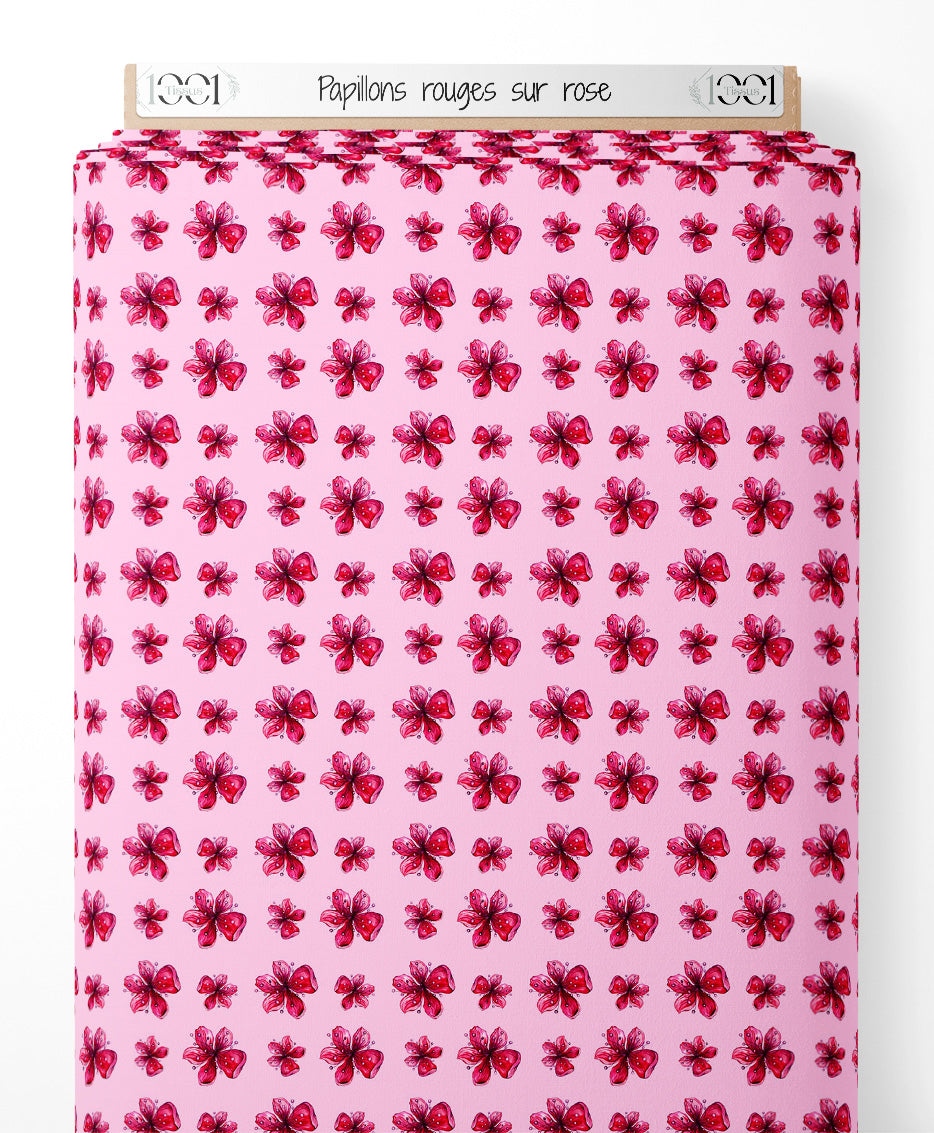 Tissu - Papillons rouges sur rose