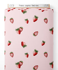 Tissu - Fraises coupées sur fond rose