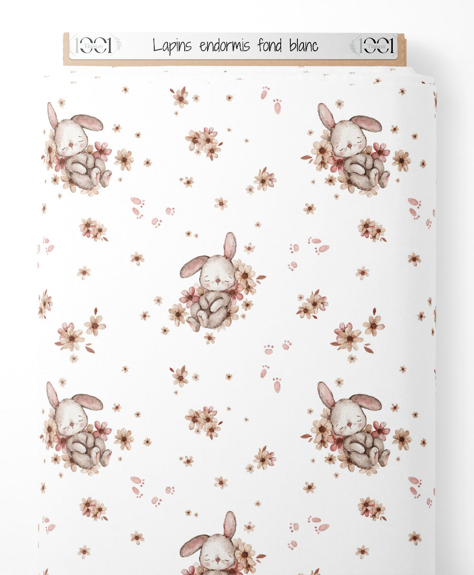 Tissu - Lapins endormis sur fond blanc