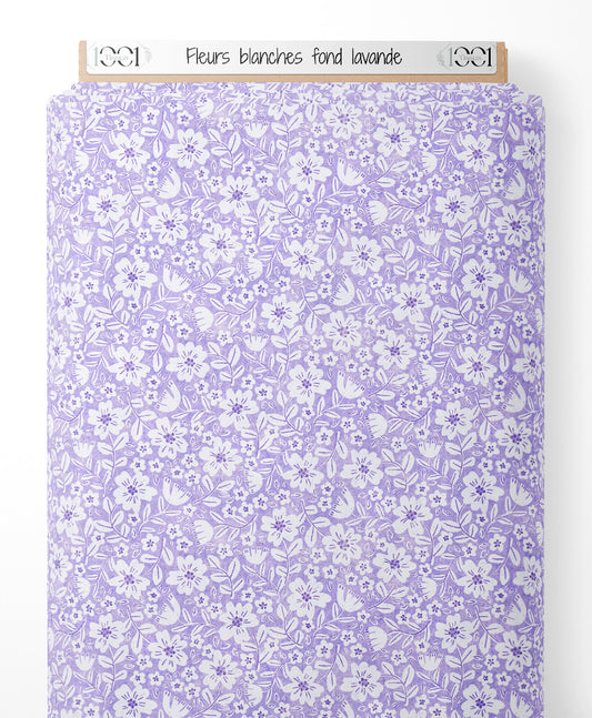 Tissu - Fleurs blanches sur fond lavande