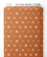 Tissu - Fleurs stylisées sur fond brun
