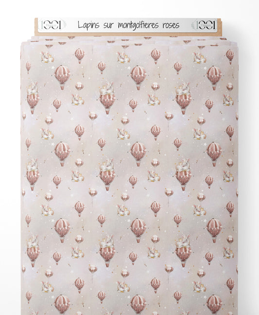 Tissu - Lapins sur montgolfières roses