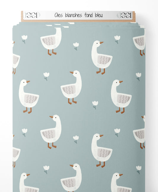 Tissu - Oies blanches sur fond bleu