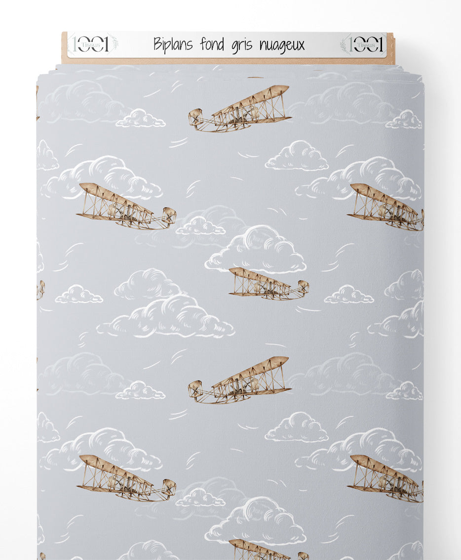 Tissu - Biplans sur fond gris nuageux