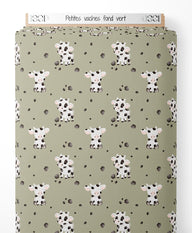 Tissu - Petites vaches sur fond vert
