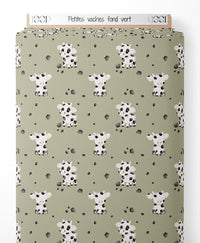 Tissu - Petites vaches sur fond vert