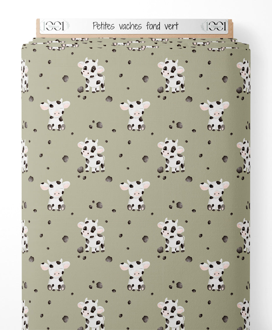 Tissu - Petites vaches sur fond vert