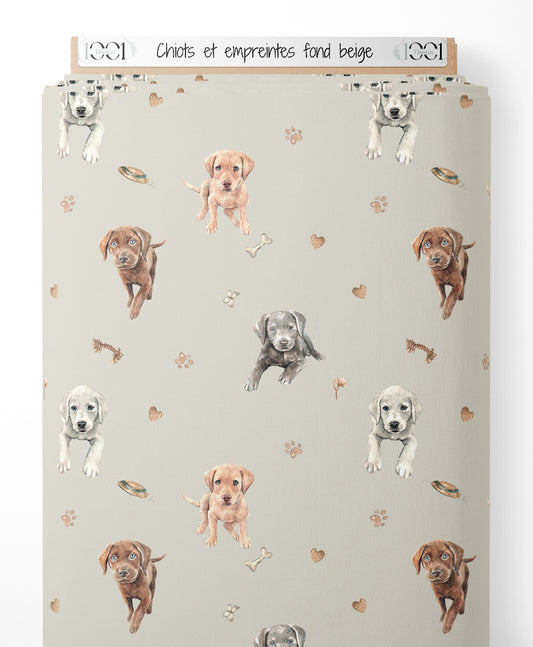 Tissu - Chiots et empreintes sur fond beige