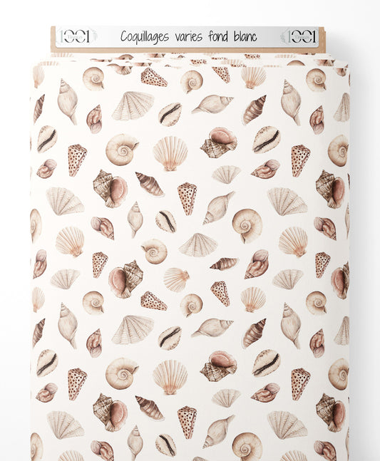 Tissu - Coquillages variés sur fond blanc