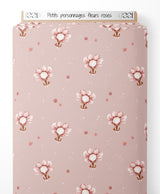 Tissu - Petits personnages fleurs roses