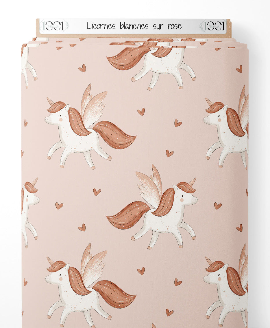 Tissu - Licornes blanches sur rose