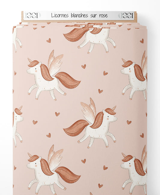 Tissu - Licornes blanches sur rose