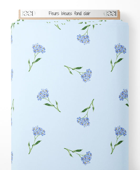 Tissu - Fleurs bleues sur fond clair