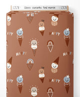 Tissu - Glaces souriantes sur fond marron
