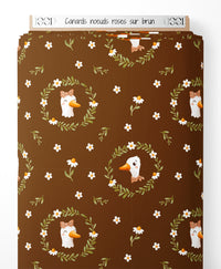 Tissu - Canards nœuds roses sur brun