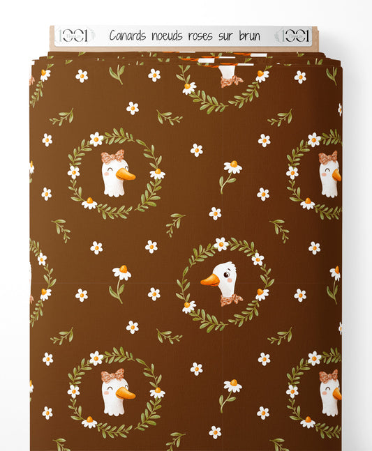 Tissu - Canards nœuds roses sur brun