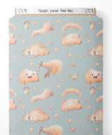 Tissu - Nuages joyeux sur fond bleu