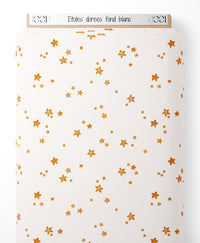 Tissu - Étoiles dorées sur fond blanc