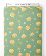 Tissu - Citrons souriants sur vert