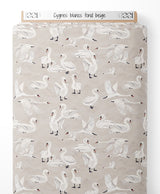 Tissu - Cygnes blancs sur fond beige