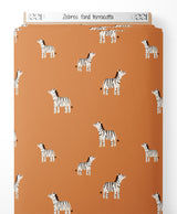 Tissu - Zèbres sur fond terracotta