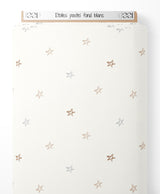 Tissu - Étoiles pastel sur fond blanc