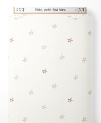 Tissu - Étoiles pastel sur fond blanc