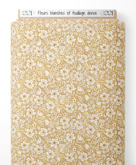 Tissu - Fleurs blanches et feuillage dense