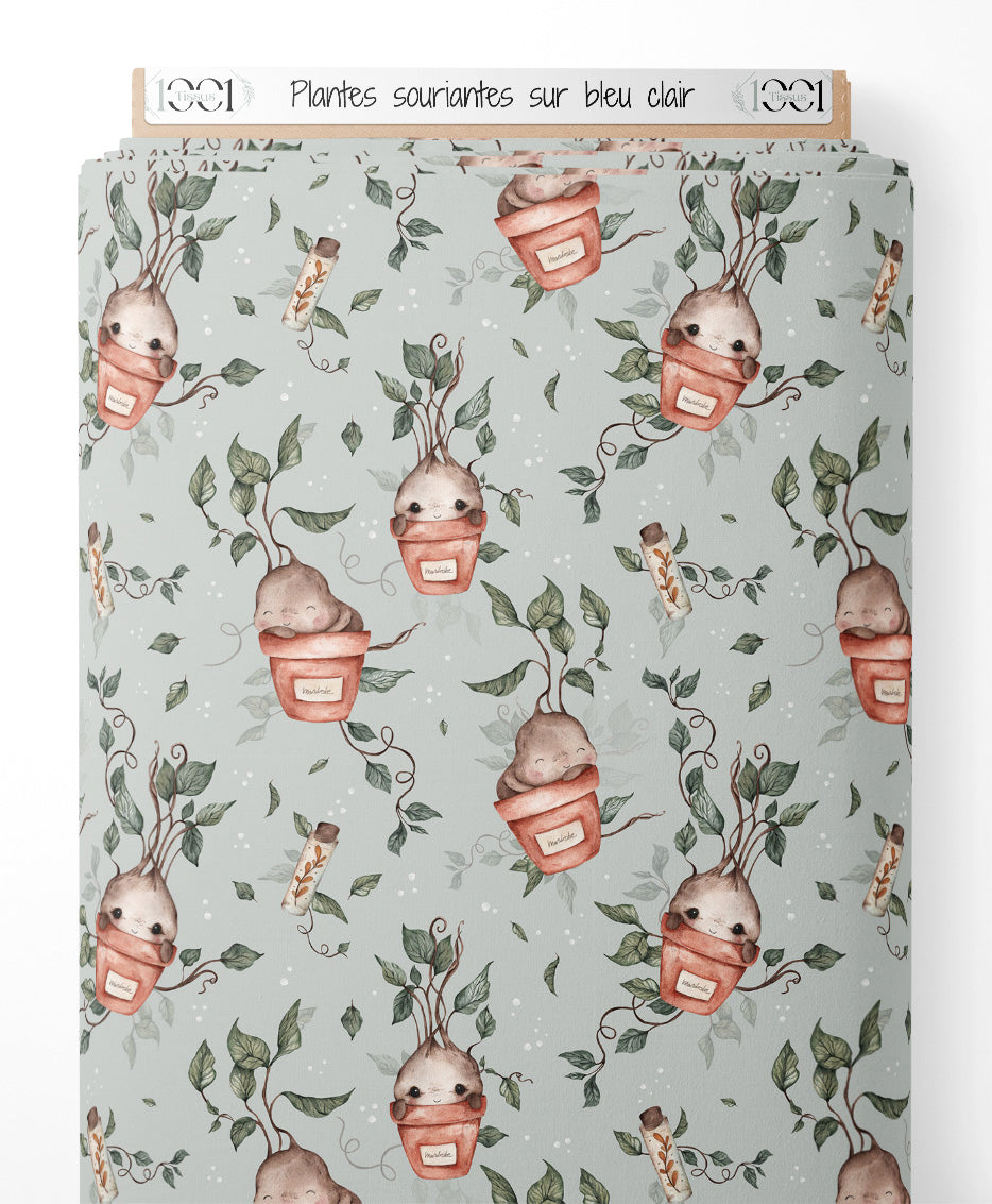 Tissu - Plantes souriantes sur bleu clair